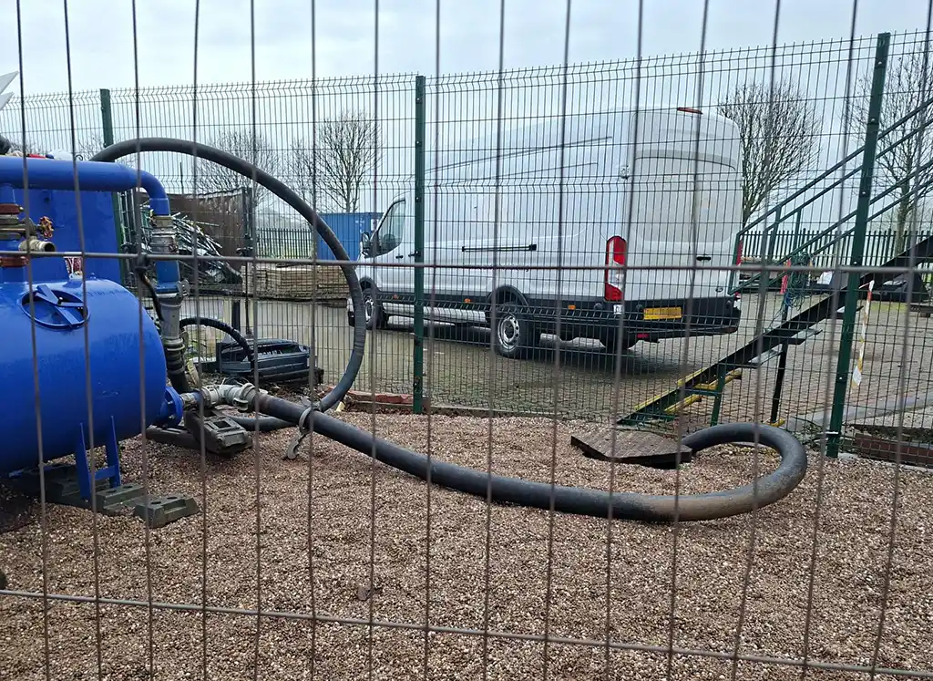 Emergency pumping and water treatment system handling hydrocarbon-contaminated groundwater during remediation works at an operational petrol station site.