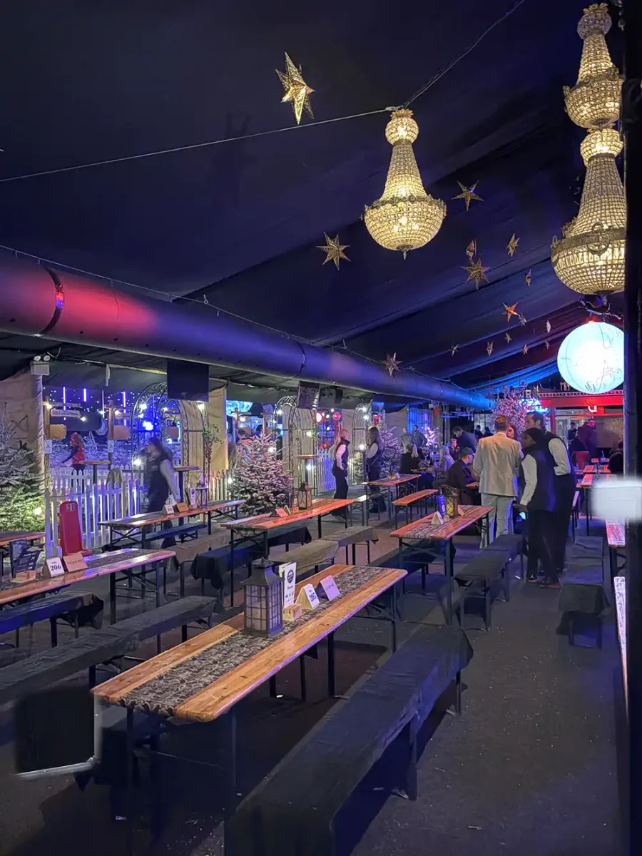A bespoke temporary event heating solution using perforated ducting to deliver consistent warmth while blending seamlessly with a premium winter event design.