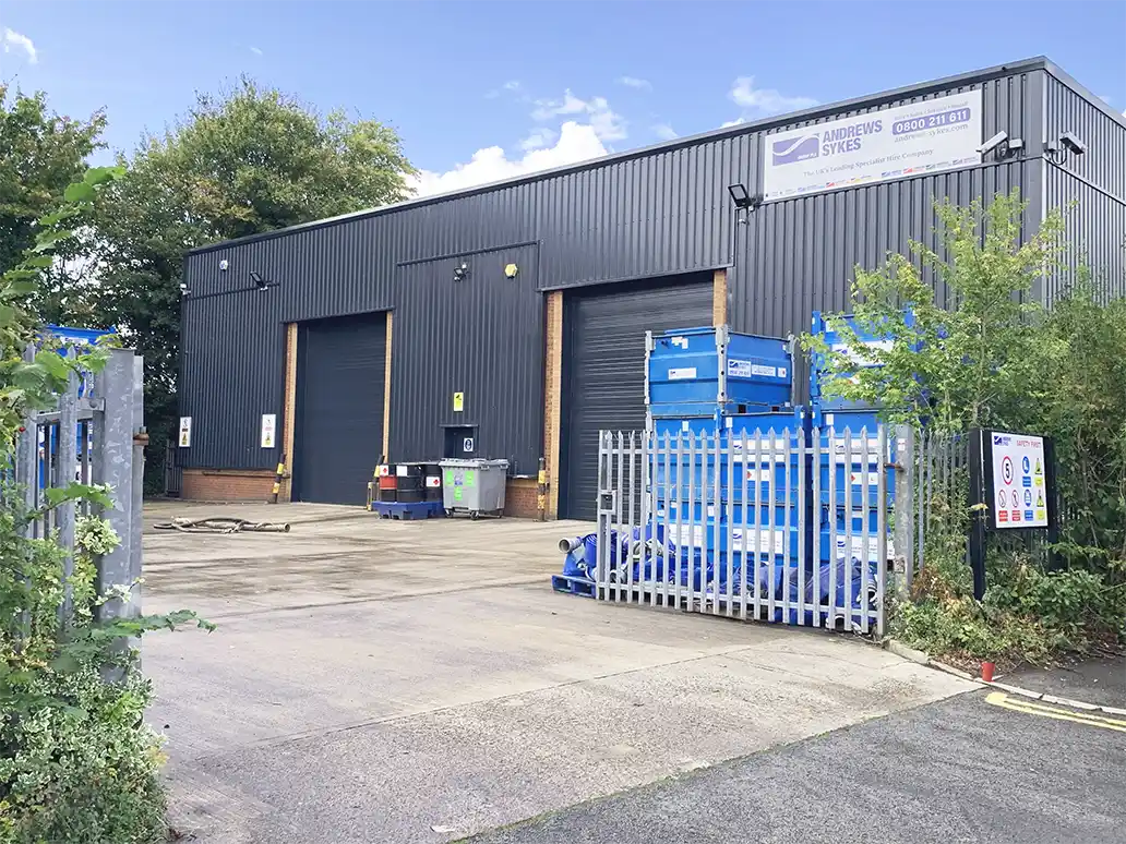 Andrews Sykes North West depot yard in Irlam, Manchester Exterior view of Andrews Sykesโ new North West depot in Irlam, Manchester, showing the secure yard with pumps and hire equipment.